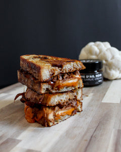 Grilled cheese with mushroom 'pulled pork' and black garlic